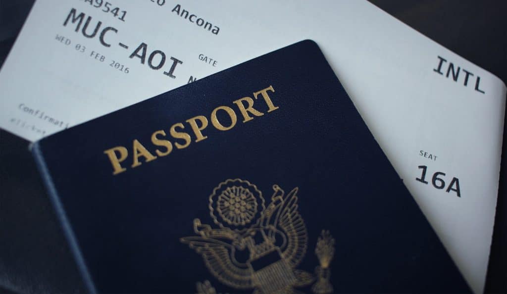 US tax forms and a calculator representing the foreign earned income exclusion and foreign tax credit